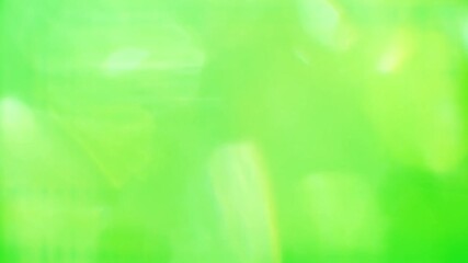 Wall Mural - Light leaks on Green background. Blurred Yellow Glimmer animated background for looping. Caused by light leaks