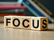 © SnapScape - Block spelling 'Focus' with books in background