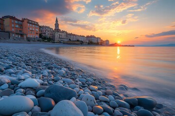 Wall Mural - Sunset over the french riviera town of saint-jean-cap-ferrat illuminating pebble beach