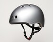© Viktor - Stylish silver helmet designed for youth and adults, showcasing a sleek, modern design.