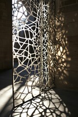 Ornate metal screen casts intricate shadows.