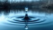 © antishock - Suspended water droplet sends ripples across a calm pool, symbolizing the impact of actions and the spreading influence of ideas
