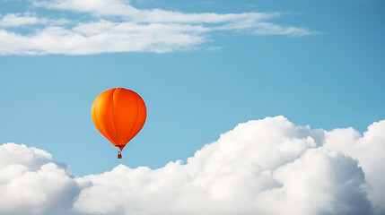 Wall Mural - A single balloon floating against a backdrop of fluffy white clouds.