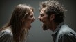 © Pham Ty - A man and a woman yelling angry at each other. Breaking family happiness and love. Causes of increased divorce.