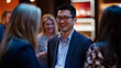 © Mirjana - Businesspeople engage in networking conversation at professional event in evening atmosphere