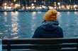 © senyumanmu - Woman Sitting on Bench  Winter City Lights  Snowfall