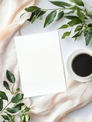 Leinwandbilder - Elegant workspace with blank paper coffee cup and green leaves on fabric for creative designs or content ideas. Generative AI