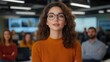 © voragit - Confident Woman with Glasses Engaging with Diverse Group of People in a Professional Setting Highlighting Collaboration and Communication Skills