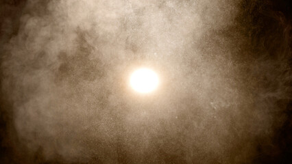 Wall Mural - light shining through brown smoke and particles creating an abstract background