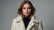 © Jayk - Portrait of a young, modern woman,wearing a luxurious coat