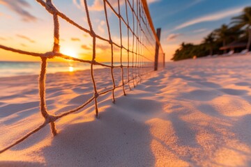 Poster - A scenic view of an empty beach volleyball court at sunrise, with soft light illuminating the sand and net