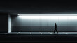 © Art_spiral - Silhouette of Lone Man Walking Along Modern Underground Corridor with Minimalist Lighting Highlighting Geometric Design Futuristic Ambiance and Solitude in Quiet Urban Environment