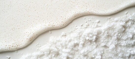 Wall Mural - white liquid and powder on a light background with textured surfaces and copy space for text placeme