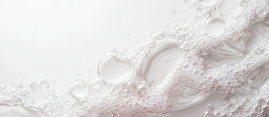 Wall Mural - bubbles and foam on white background with water droplets and copy space for text