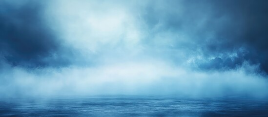Wall Mural - abstract blue landscape with clouds and mist over calm water surface copy space