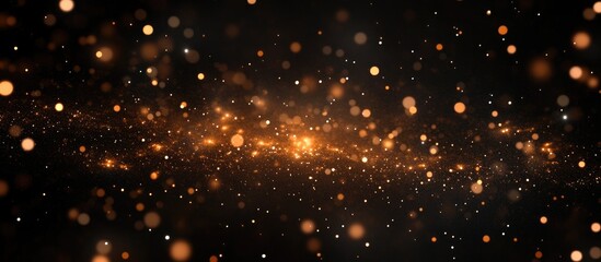 Wall Mural - abstract background of golden sparks and bokeh lights with dark blurred backdrop suitable for variou