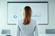 © JP STUDIO LAB - Professional woman standing in front of a whiteboard with charts and graphs discussing strategy in a corporate meeting