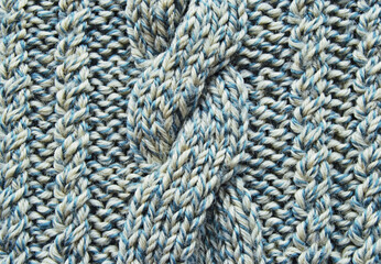 soft light blue wool crossed cable ornament texture as background