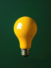 Wall Mural - Yellow Light Bulb on Green Background