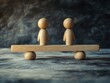 © vefimov - A wooden balance scale with two people on either side, symbolizing cooperation and work, or the idea of weighing one's actions against another.
