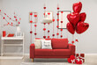 © Pixel-Shot - Interior of living room decorated for Valentine's Day with balloons, sofa and gifts