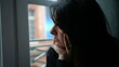 © Marco - Pensive melancholical woman looking out window thinking