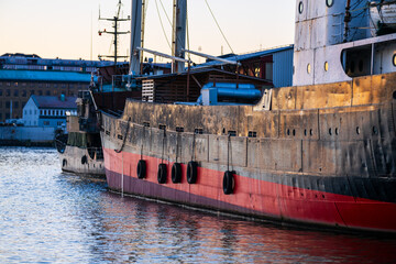 Wall Mural - Side of a vintage freight ship at port.