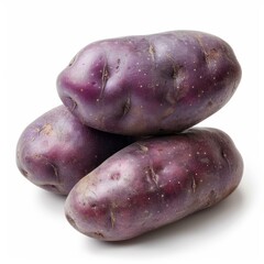 Canvas Print - Three whole unpeeled vitelotte potatoes forming a pyramid shape are laying on a white background