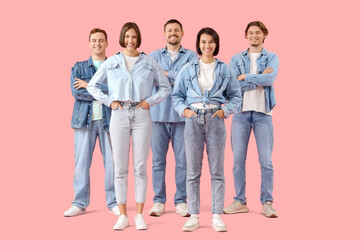 Wall Mural - Group of young people in denim clothes on pink background