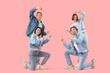 © Pixel-Shot - Group of young people in denim clothes pointing at something on pink background