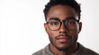 © hocine - Young man with glasses showcasing a confident expression against a neutral background, perfect for portraits, lifestyle, and personal branding concepts