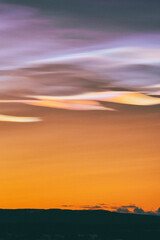 Wall Mural - Mother-of-pearl clouds above Toten, Norway, in January 2025.