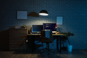 Sticker - Interior of dark programmer's office with workplace and glowing lamp