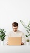 © Sangsung - Young Man Working on Laptop Among Indoor Plants