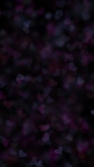 Dark violet blue blurred heart bokeh loop slow motion on black vertical background.