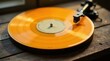 © Angel Pic - A vibrant golden vinyl record spins on a vintage turntable, bathed in warm sunlight on a rustic wooden surface, evoking a feeling of nostalgic musical enjoyment.