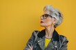 © Anjali - Empowered older woman in retro fashion poses confidently.