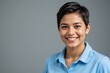 © SR Creative Idea - Portrait of a Smiling Young Woman with Short Brown Hair Wearing a Light Blue Polo Shirt