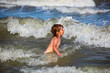 © Volodymyr - Kid swimming having fun and jumping in the waves of the sea. Summer kids vacation and healthy lifestyle concept.