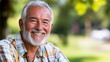 © NAIMAH - Portrait of a Happy Senior Man in a Park