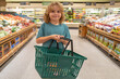 © Volodymyr - Child with shopping basket. Shopping with kids. Kid buying fruit in supermarket. Little boy buy fresh vegetables in grocery store. Kid choosing vegetables. Healthy food.
