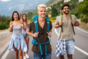 Wall Mural - friendship, travel, vacation, summer and people concept. group of smiling friends with map traveling