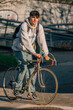 © carballo - young man on the street riding on vintage bicycle