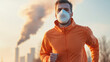 © Jirawatfoto - Running man in orange jacket wearing mask, pollution in background