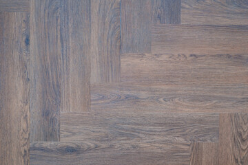 Poster - A wooden floor with a checkered pattern. The floor is made of wood and has a brown color