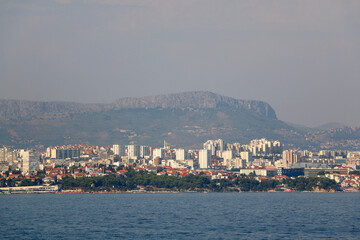 Wall Mural - Contemporary buildings, gardens and beaches at the waterfront in Split, Croatia. View of Split from the boat.