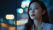 © InspirationDesign - Asian professional woman in evening city light. Ideal for corporate success, urban professional, or business excellence.