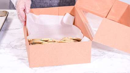 Canvas Print - Packing Sprinkle-Adorned Sugar Cookies into Boxes