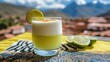 © Julia Jones - Pisco Sour Day Refreshing lime cocktail with scenic mountain view for relaxation and inspiration