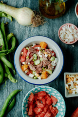 Wall Mural - andalusian broad bean salad served on a white bowl